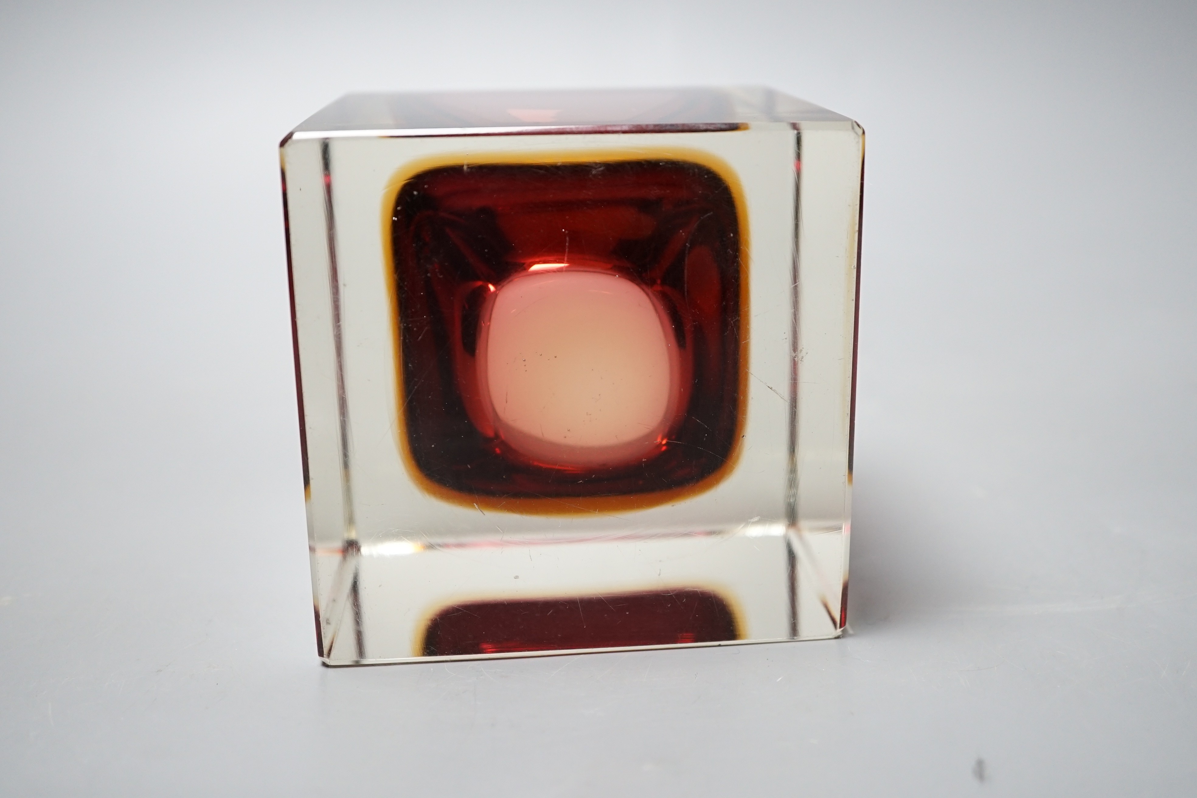 A Murano red, amber and clear cased glass cube vase, 9.5cm tall